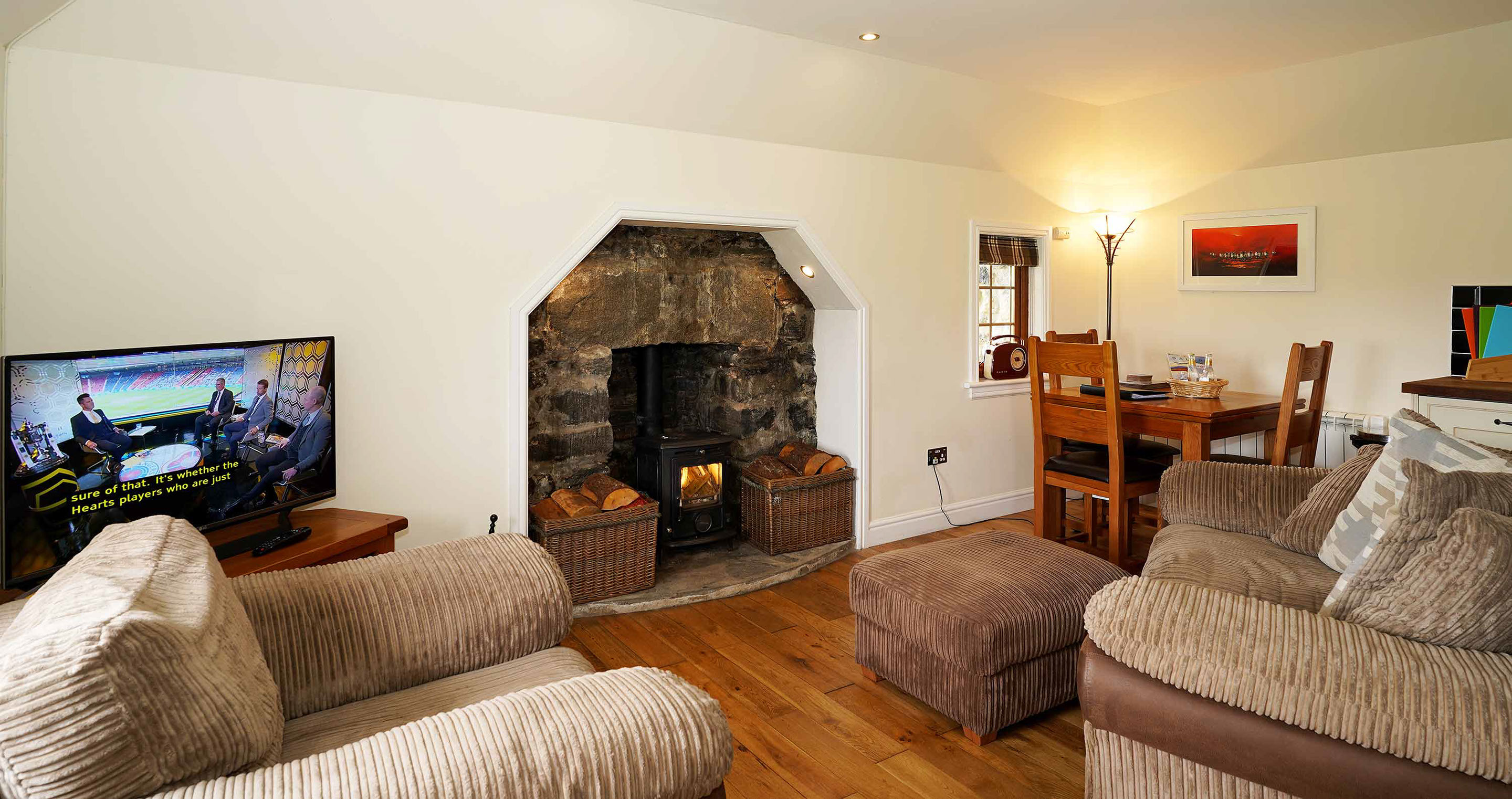 Culla Self Catering Cottage in Benbecula contains a Woodburning Stove Smart Widescreen TV and Dining Table
